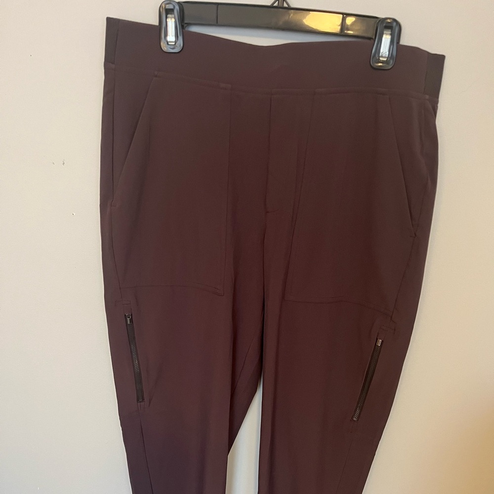 Athleta soft stretch jogger pants (plum color) with zipper pockets. Size 12.
